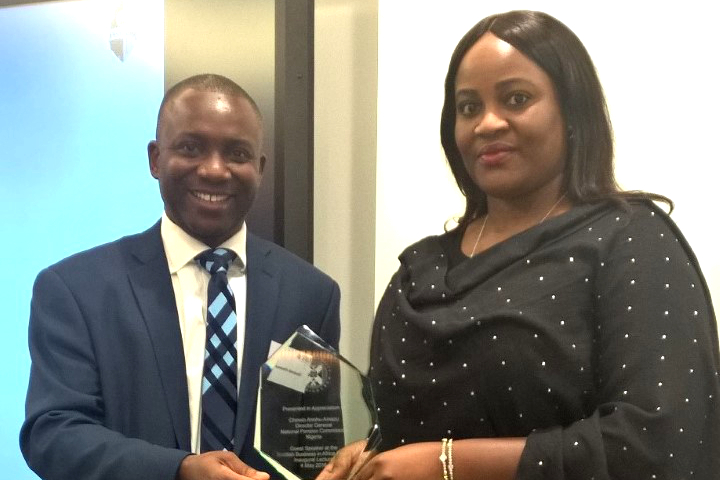 Kenneth awarding trophy to Chinelo Anohu-Amazu